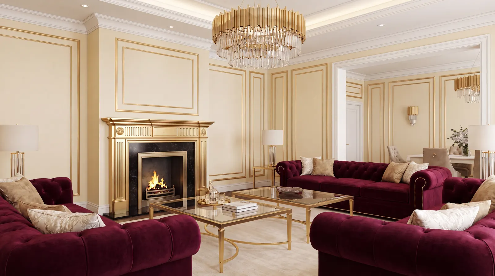 Wohnzimmer in Creme und Gold mit Chesterfield-Sofas in Bordeaux und offenem Kamin